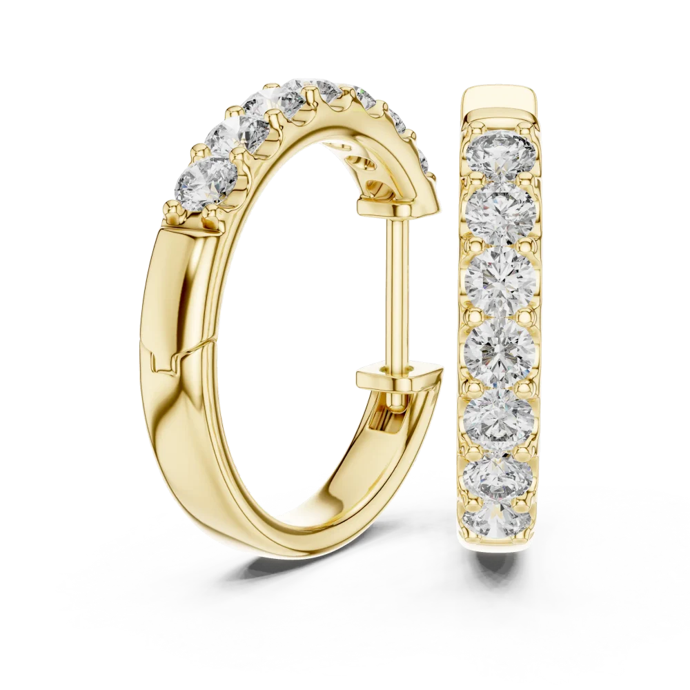 Luminary round brilliant pavé-set gold hoop earrings featuring a seamless row of sparkling diamonds on a white surface.