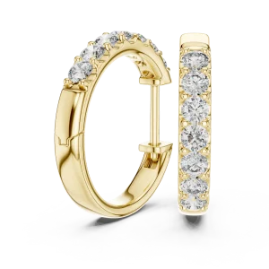 Luminary round brilliant pavé-set gold hoop earrings featuring a seamless row of sparkling diamonds on a white surface.