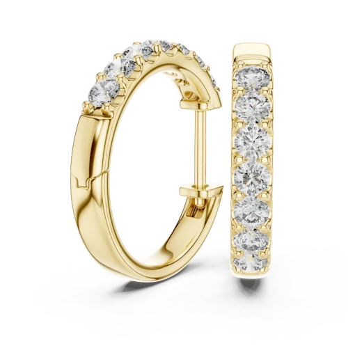 Luminary round brilliant pavé-set gold hoop earrings featuring a seamless row of sparkling diamonds on a white surface.