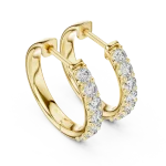 Luminary gold hoop earrings featuring a pavé-set row of brilliant-cut DIAMEUR diamonds for exceptional sparkle.