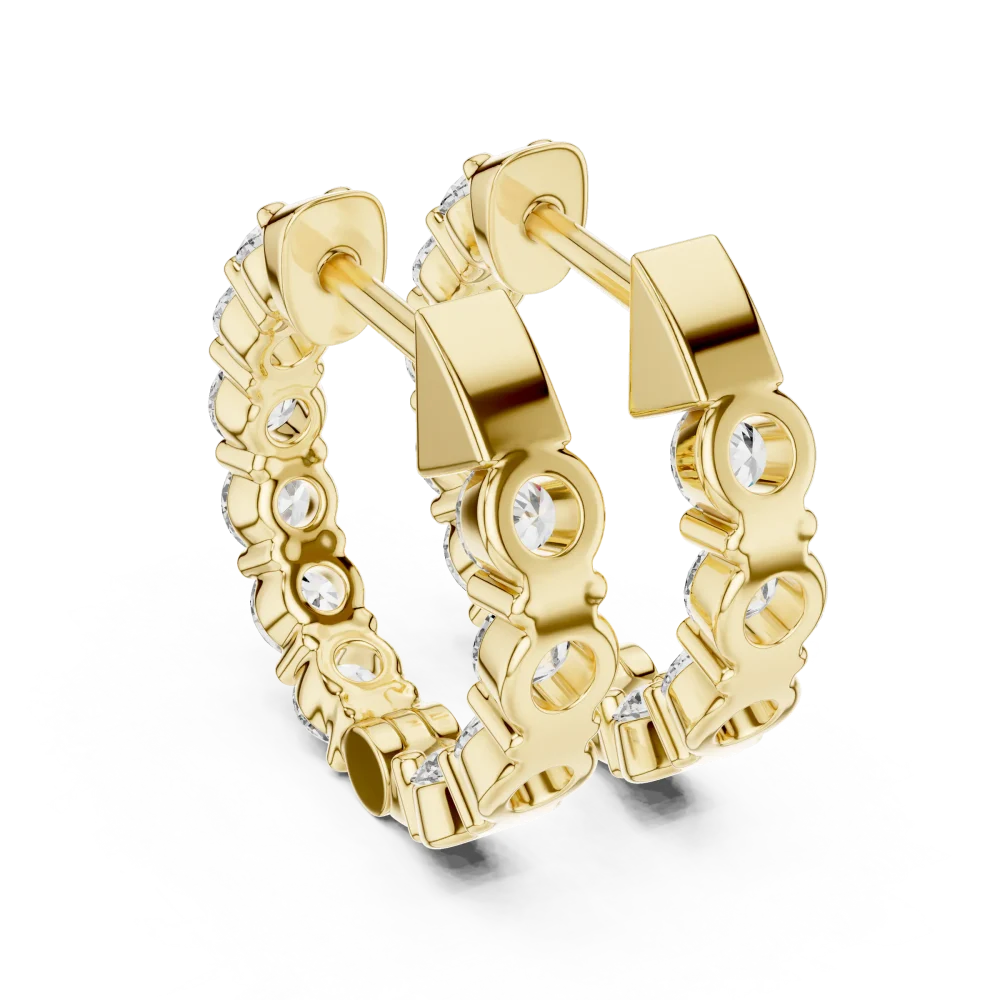 Gold huggie hoop earrings featuring a row of sparkling round lab-grown diamonds in a sophisticated, polished setting.