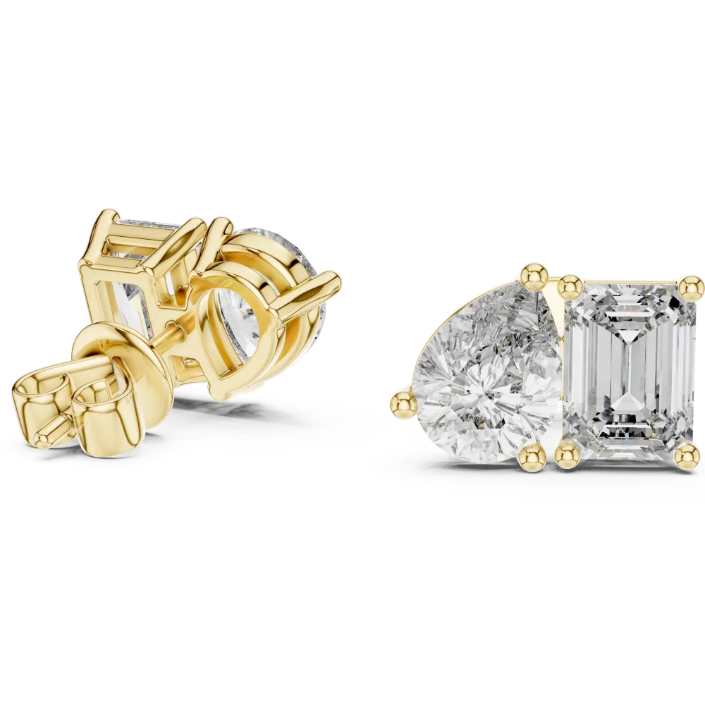 Two stone lab grown diamond stud earrings featuring a pear cut and emerald cut diamond set in polished gold.