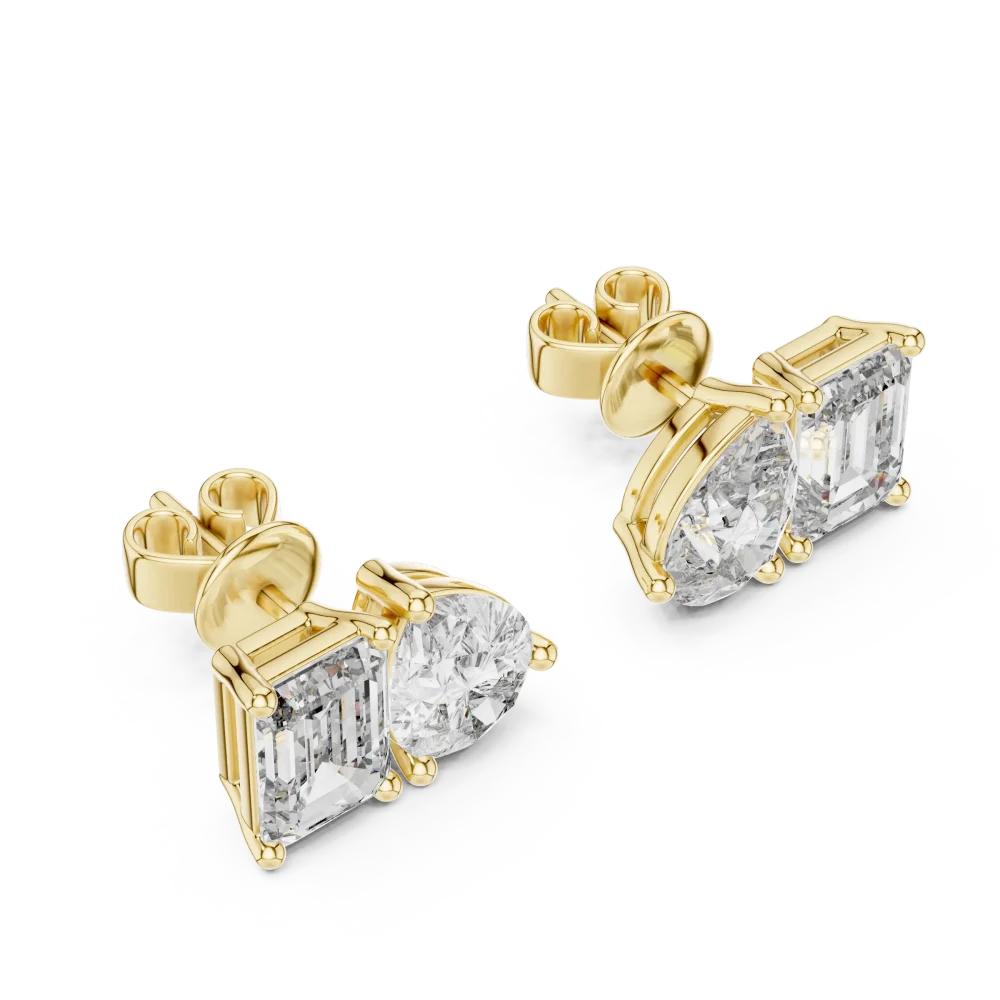 Two stone lab grown diamond stud earrings featuring pear and emerald cut stones set in lustrous gold.