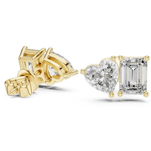 Duo lab-grown diamond stud earrings in yellow gold, featuring one heart-shaped and one emerald-cut stone.
