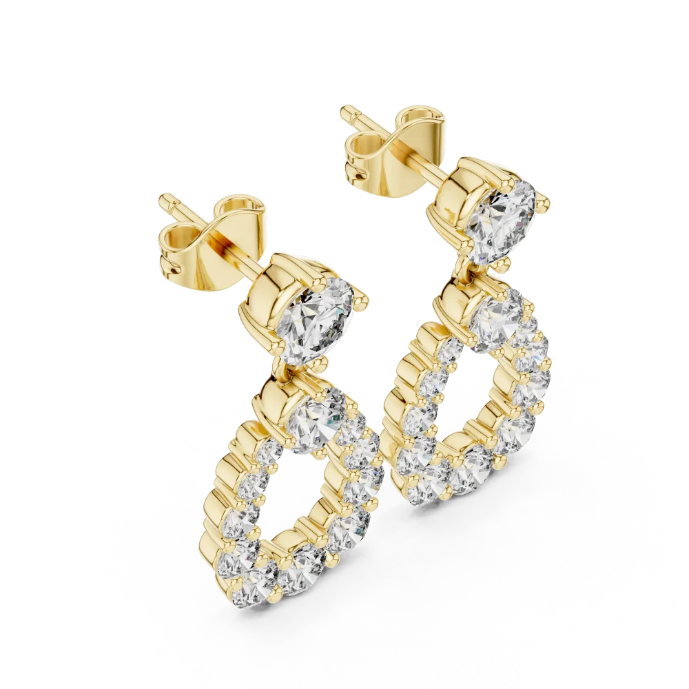 Discover the radiant allure of these pear-silhouette drop earrings, featuring brilliant-cut DIAMEUR diamonds. Elevate your style and shop today.