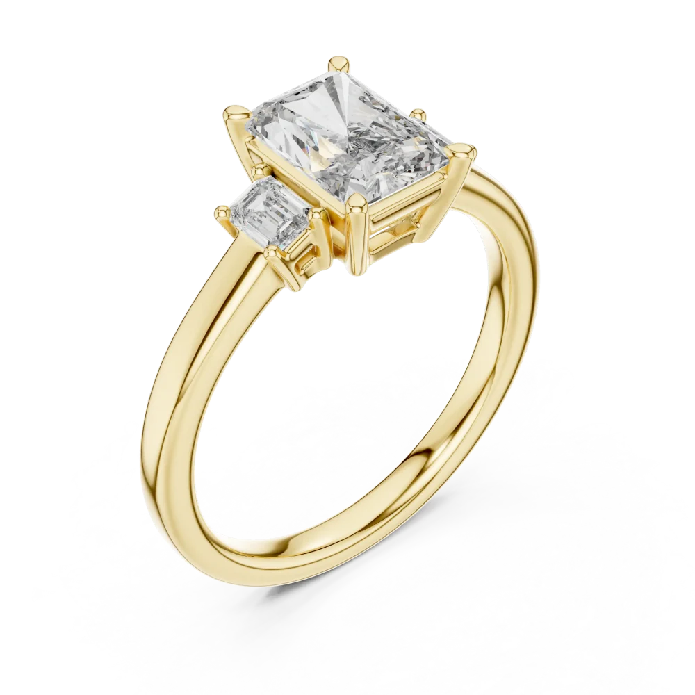 Embrace modern elegance with this Radiant and Emerald three-stone ring. Featuring superior DIAMEUR diamonds, discover sustainable luxury today.