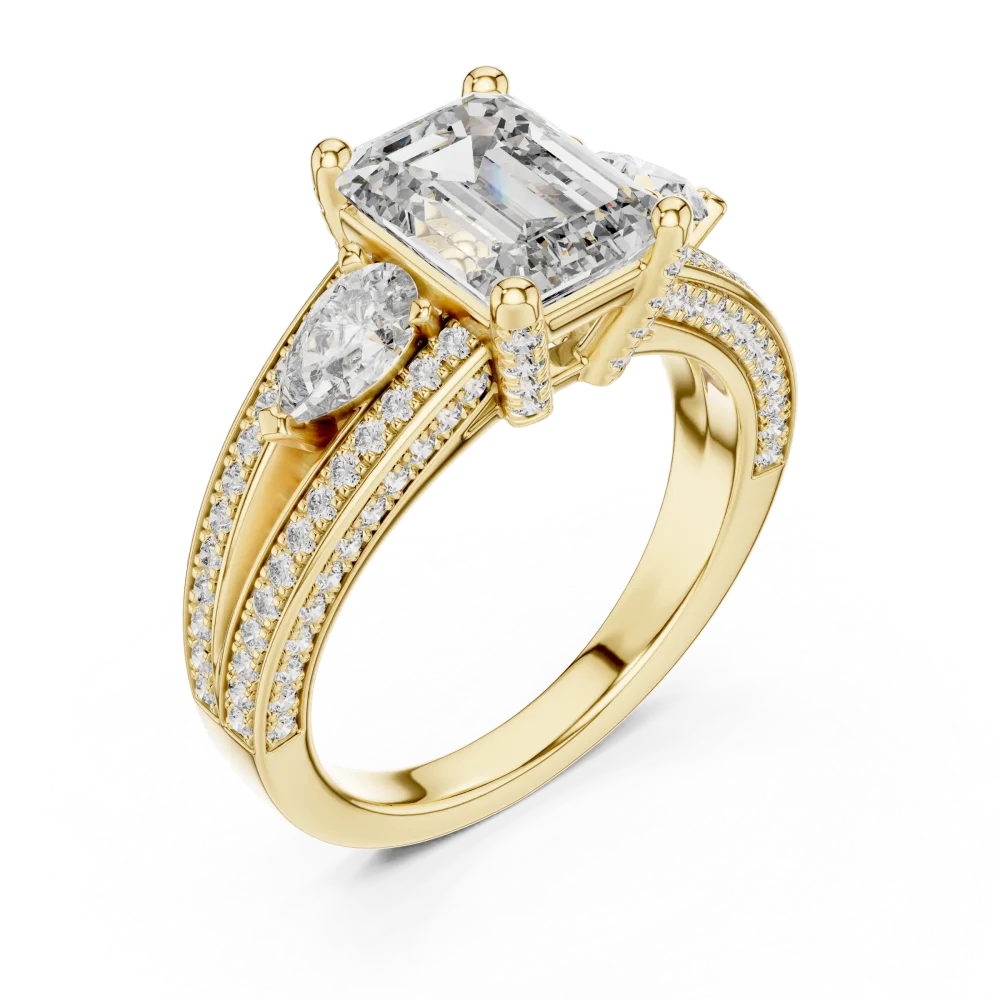 Discover the Luminary Emerald and Pear Ring, featuring brilliant lab-grown DIAMEUR diamonds set in a stunning three-stone design. Shop the look now.