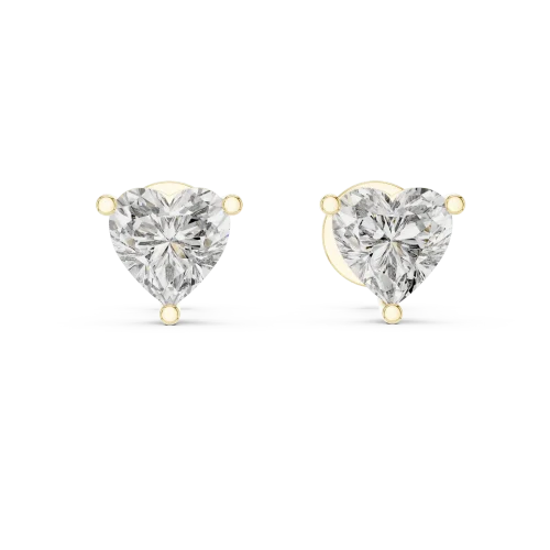 Ethereal Heart Solitaire Stud Earrings featuring heart-cut DIAMEUR diamonds set in polished gold prongs on a grey background.