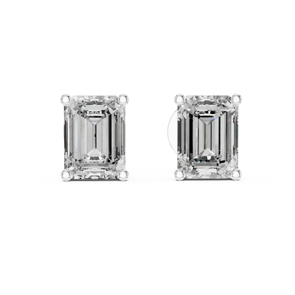 Architectural Emerald Cut Solitaire Stud Earrings featuring elongated geometric DIAMEUR diamonds in a four-prong setting.