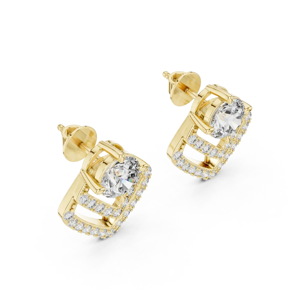 Luminary gold stud earrings featuring a central round brilliant diamond surrounded by geometric chevron pavé detailing.