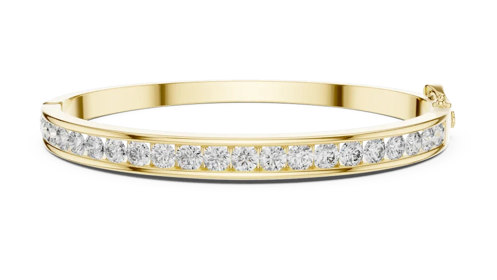 Adorn your wrist with this radiant channel-set bangle, featuring brilliant DIAMEUR diamonds. Experience modern luxury and unmatched light today.