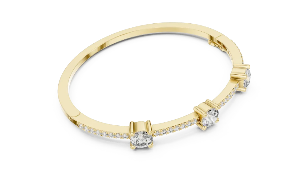 Experience radiant luxury with this triple DIAMEUR solitaire bangle. Expertly crafted for brilliance, it’s the ultimate statement piece. Shop now.