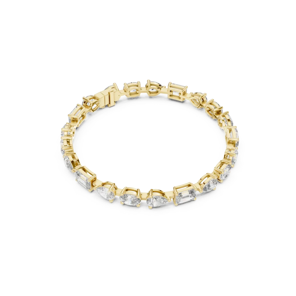 Experience unmatched brilliance with this mixed-cut tennis bracelet featuring emerald, oval, and pear DIAMEUR diamonds. Elevate your style and shop now.
