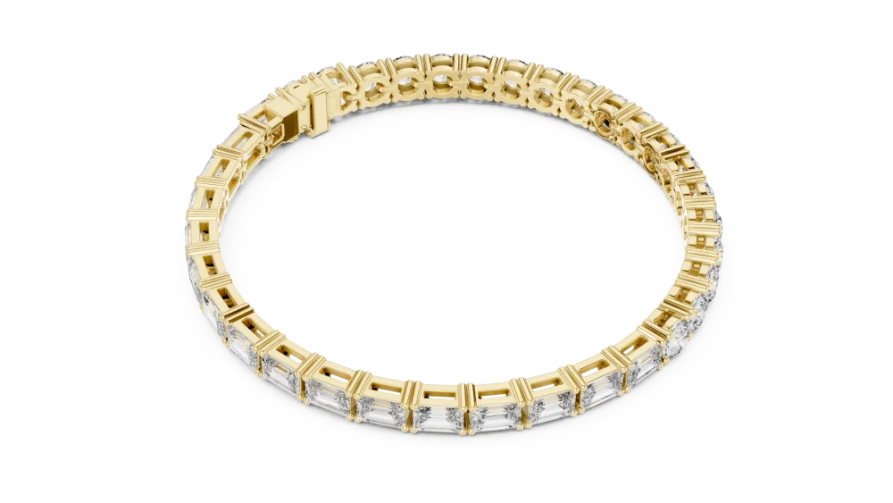 Adorn your wrist with the brilliance of this emerald and round-cut DIAMEUR diamond tennis bracelet. A timeless luxury statement. Shop now.
