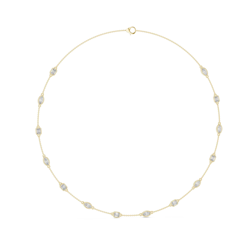 Discover the radiant Symmetry Station Necklace, featuring brilliant emerald and marquise DIAMEUR diamonds in a chic bezel setting. Shop the look now.