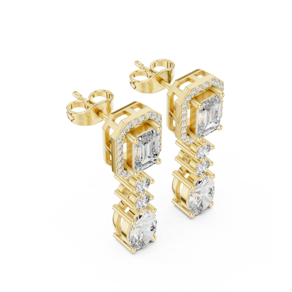 Elevate your look with these architectural drop earrings featuring emerald and oval DIAMEUR diamonds. Experience sustainable luxury today. Shop now.