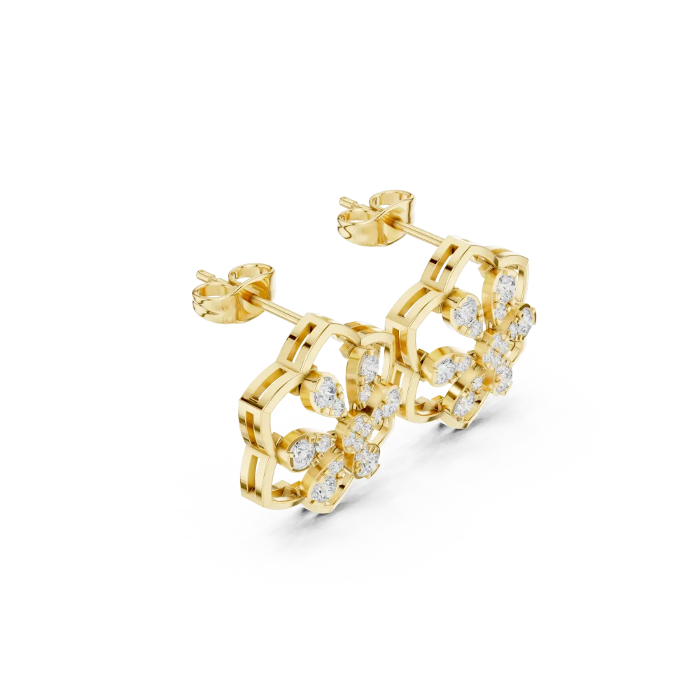 Experience modern elegance with these floral-inspired diamond stud earrings. Handcrafted in pure gold, these brilliant DIAMEUR diamonds shine bright. Shop now.
