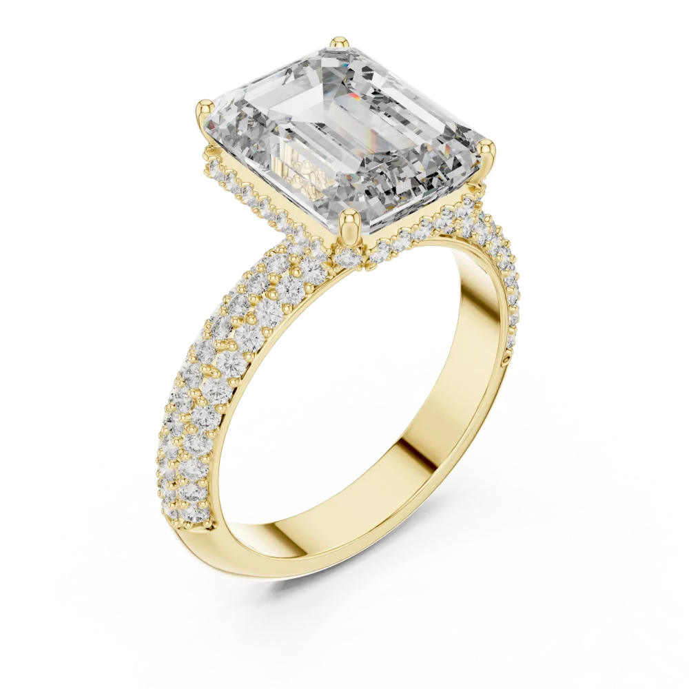 Discover the radiant allure of this Emerald Cut Solitaire Ring, featuring brilliant DIAMEUR diamonds and pavé-set craftsmanship. Shop this icon now.