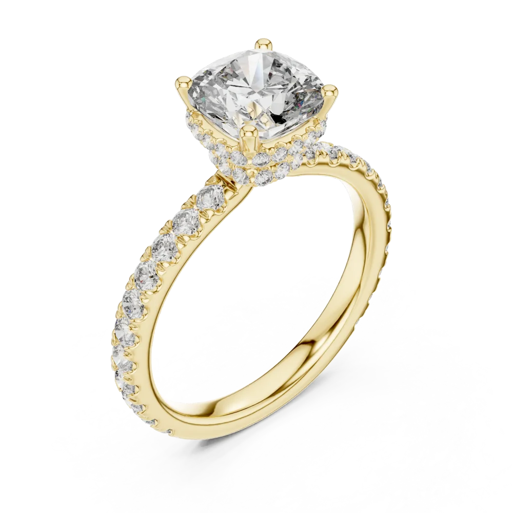 Embrace timeless elegance with this cushion cut solitaire ring, featuring a brilliant hidden halo and pavé-set diamonds. Shop this modern luxury.
