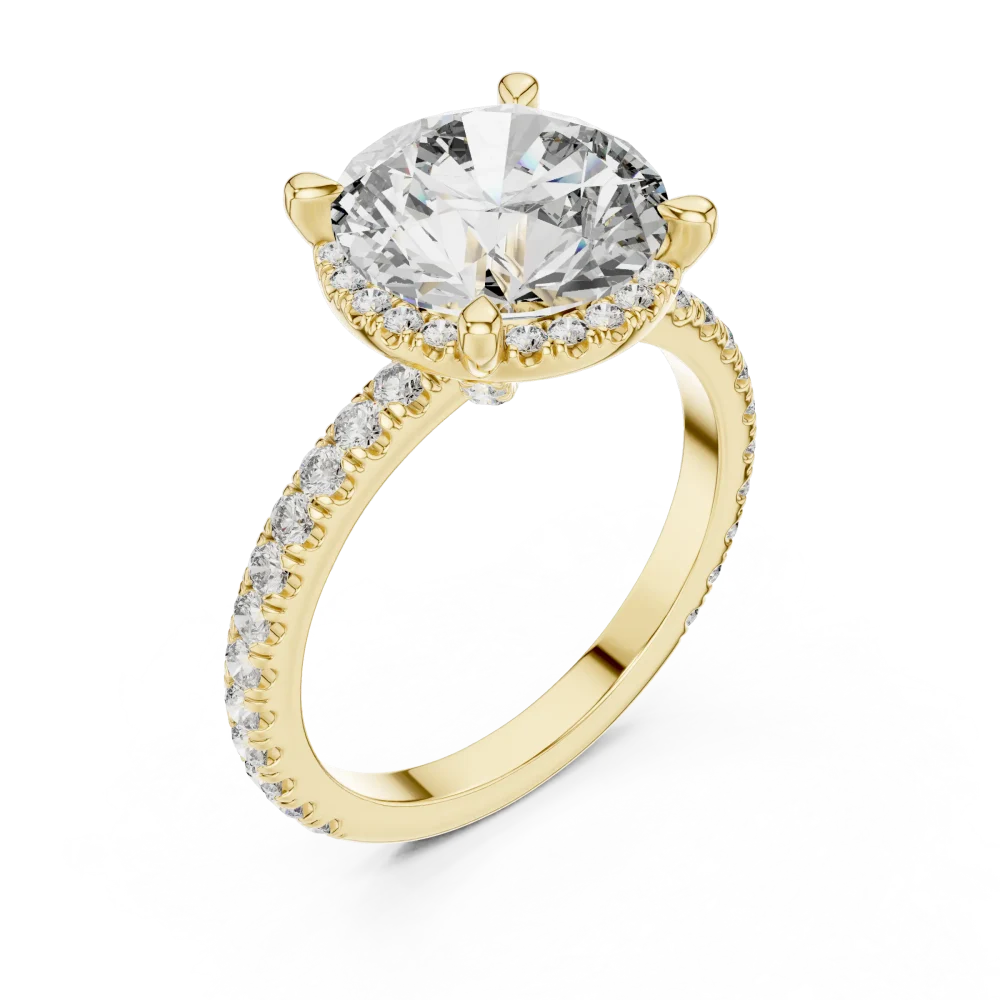 Discover the radiant beauty of our pavé-set round solitaire engagement ring. Crafted for brilliance, this sustainable luxury masterpiece awaits you.