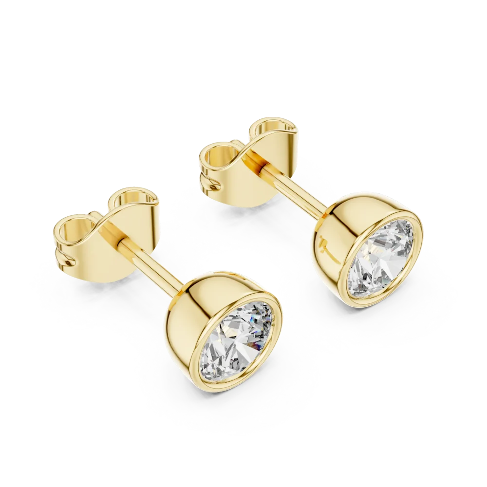 Elevate your style with these stunning round bezel-set solitaire stud earrings. Crafted for brilliance, these diamonds are the ultimate modern classic. Shop now!