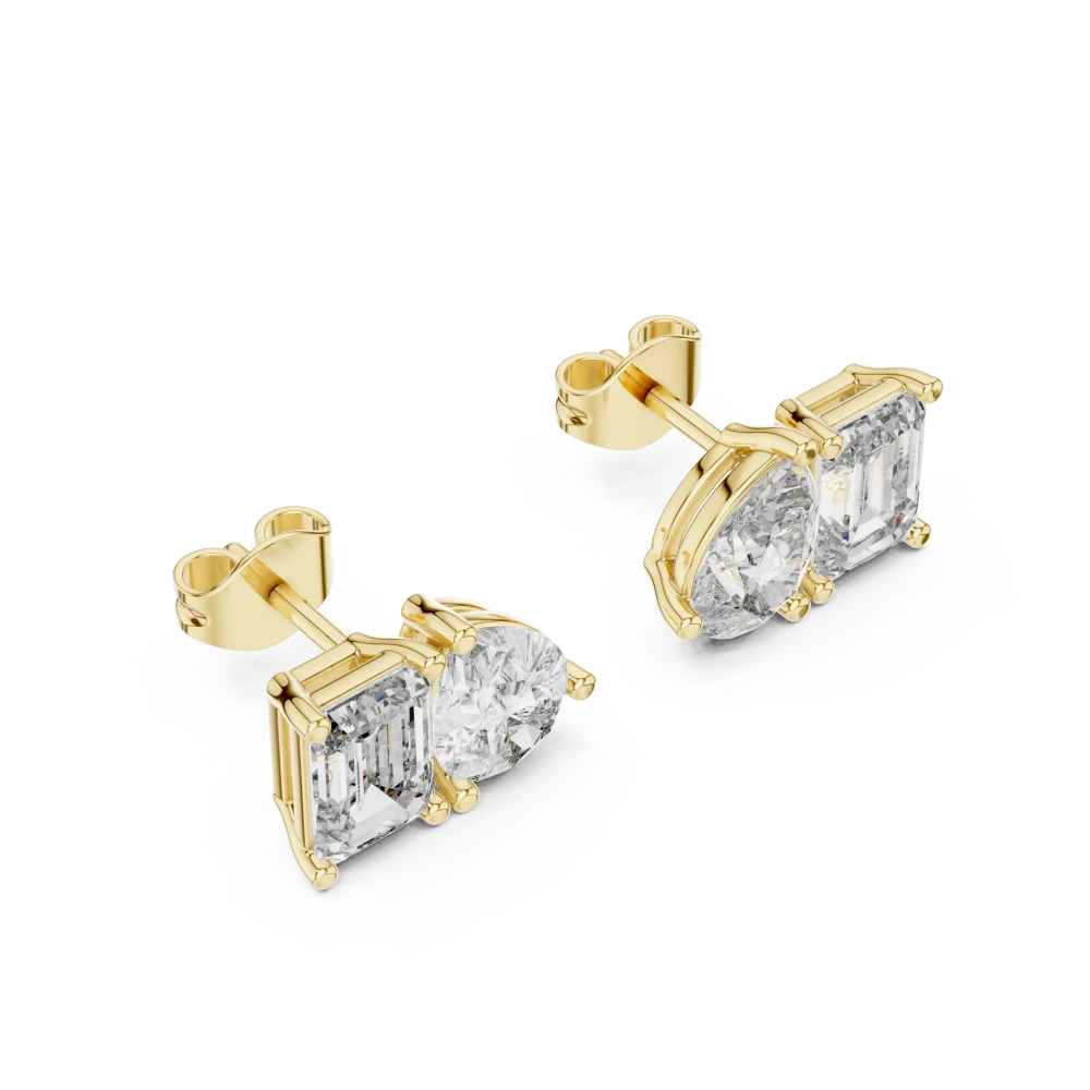 Elevate your style with these stunning dual-stone stud earrings. Featuring emerald and pear-cut DIAMEUR diamonds, discover modern elegance today.